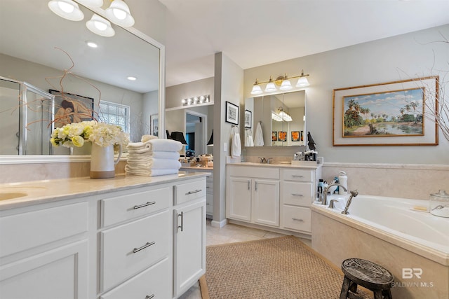 bathroom with tile floors, independent shower and bath, and oversized vanity