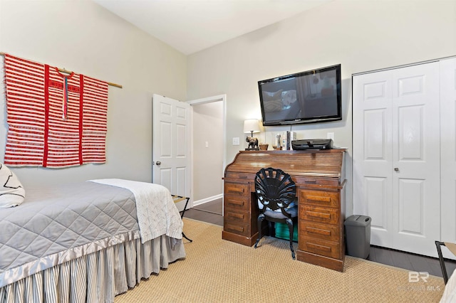 carpeted bedroom with a closet