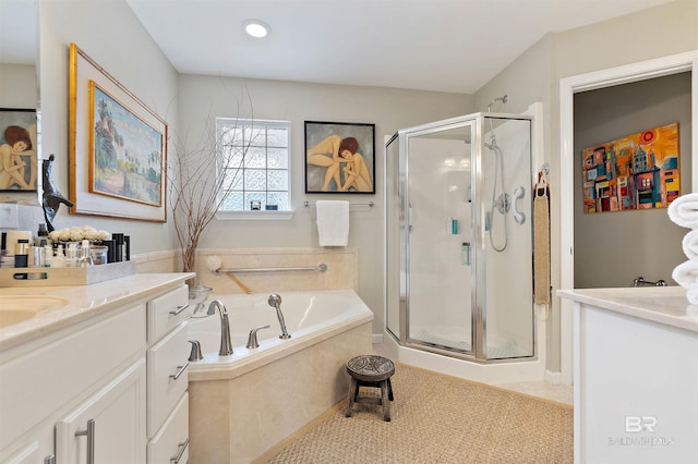 bathroom featuring tile patterned flooring, vanity, and a shower stall