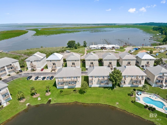 birds eye view of property with a water view