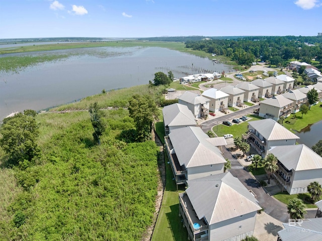 bird's eye view featuring a water view and a residential view