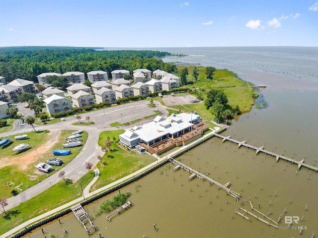 birds eye view of property with a water view and a residential view