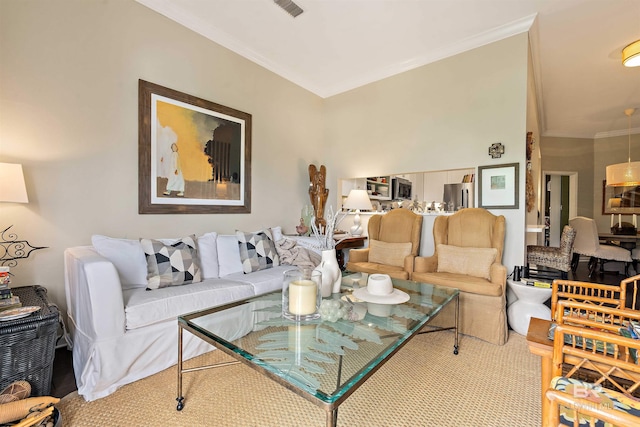 living area with ornamental molding