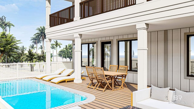 view of pool with a deck, outdoor dining space, and a fenced in pool