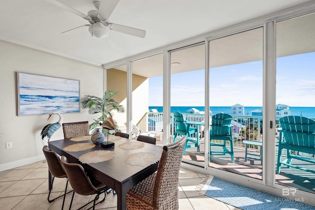 1524 W Beach Blvd Unit 506, Gulf Shores, AL 36542 - tiled dining room featuring a water view and ceiling fan