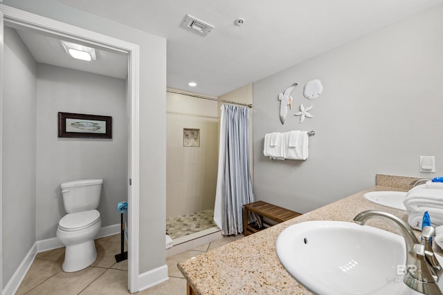 1524 W Beach Blvd Unit 506, Gulf Shores, AL 36542 - bathroom featuring tile patterned floors, vanity, curtained shower, and toilet