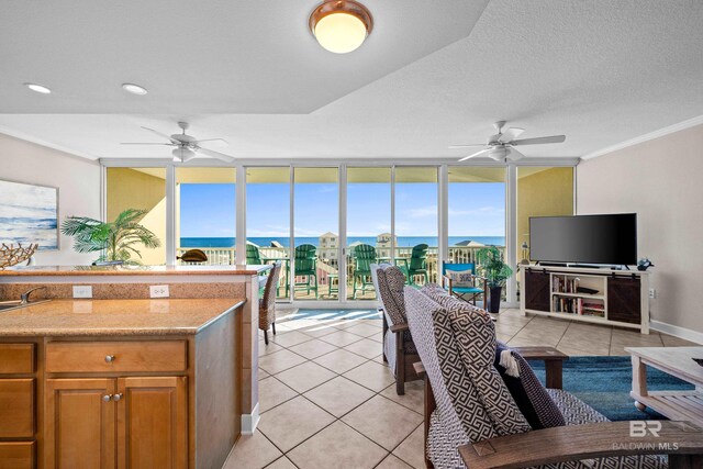 1524 W Beach Blvd Unit 506, Gulf Shores, AL 36542 - kitchen featuring light tile patterned floors, floor to ceiling windows, ornamental molding, and ceiling fan