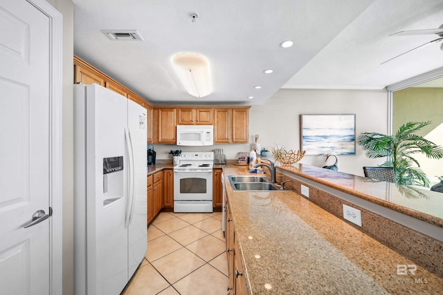 1524 W Beach Blvd Unit 506, Gulf Shores, AL 36542 - kitchen featuring light stone counters, white appliances, ceiling fan, sink, and light tile patterned floors
