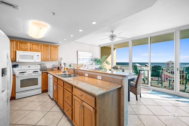 1524 W Beach Blvd Unit 506, Gulf Shores, AL 36542 - kitchen featuring ceiling fan, sink, kitchen peninsula, white appliances, and light tile patterned floors