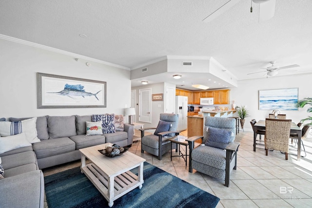 1524 W Beach Blvd Unit 506, Gulf Shores, AL 36542 - living room featuring light tile patterned floors, a textured ceiling, ceiling fan, and ornamental molding