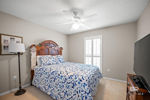 bedroom with carpet floors, a textured ceiling, and baseboards