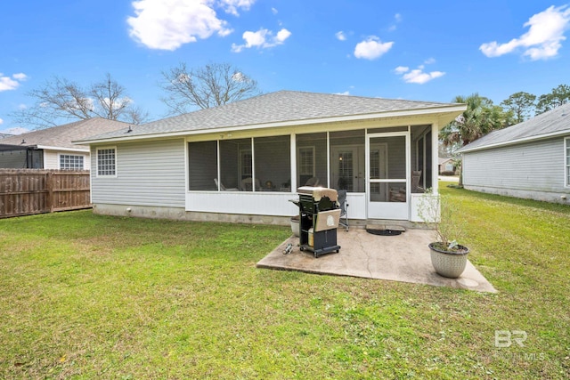 back of house featuring a patio area, fence, a sunroom, and a yard