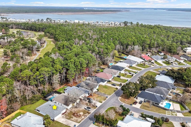 birds eye view of property with a water view and a residential view