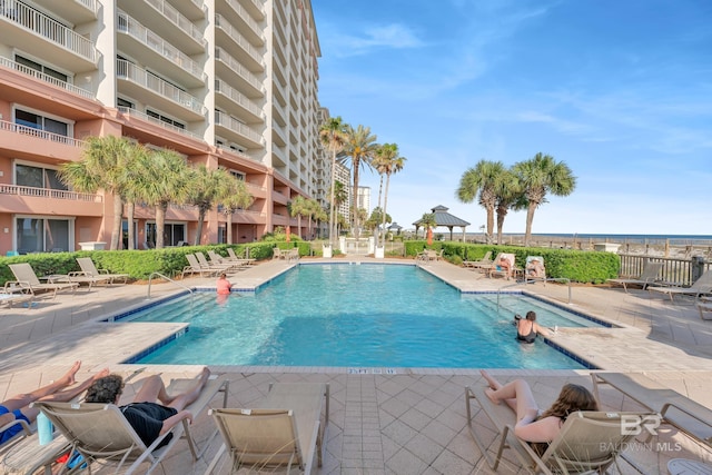 community pool with a patio area