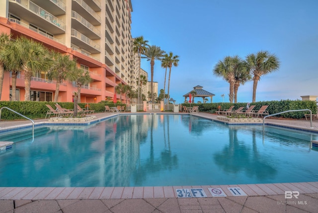 community pool featuring a gazebo