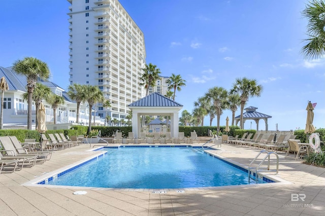 community pool featuring a gazebo and a patio area