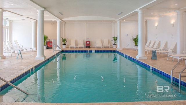 view of pool featuring decorative columns
