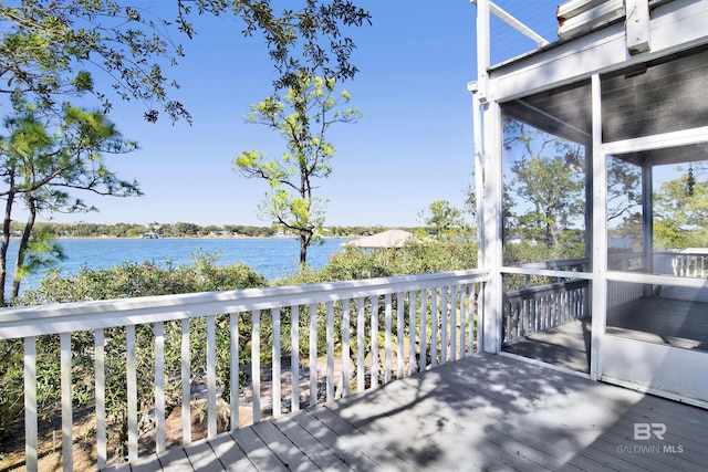 wooden deck with a water view