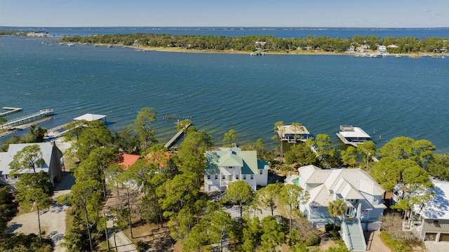 birds eye view of property with a water view and a residential view