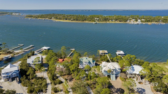 drone / aerial view featuring a water view and a residential view