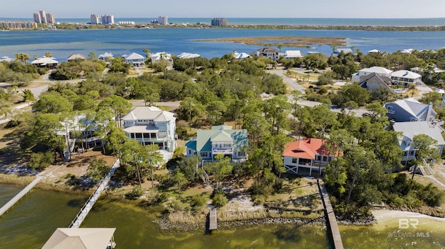 birds eye view of property with a residential view and a water view