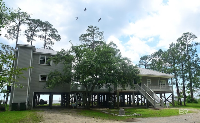 9397 S Bay Rd, Foley, AL 36535 - view of front of home with metal roof, stairway, and a carport