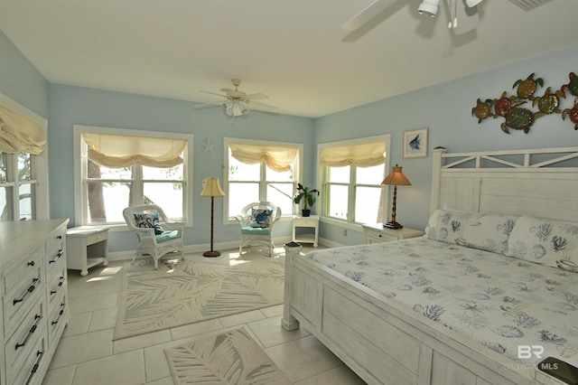 9397 S Bay Rd, Foley, AL 36535 - bedroom with light tile patterned flooring, baseboards, multiple windows, and a ceiling fan