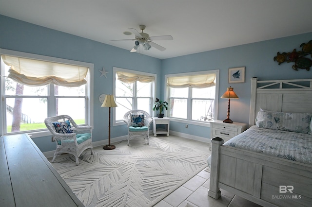 9397 S Bay Rd, Foley, AL 36535 - bedroom with baseboards, light tile patterned floors, and a ceiling fan