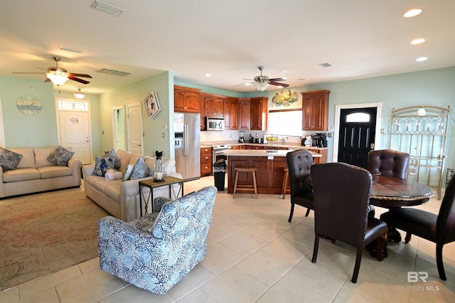 9397 S Bay Rd, Foley, AL 36535 - dining space featuring a ceiling fan, light tile patterned floors, and recessed lighting