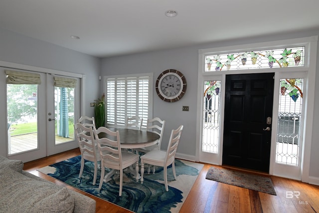9397 S Bay Rd, Foley, AL 36535 - dining space featuring french doors, light wood-style flooring, and baseboards