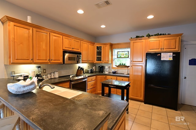 9397 S Bay Rd, Foley, AL 36535 - kitchen featuring decorative backsplash, dark countertops, visible vents, a peninsula, and appliances with stainless steel finishes