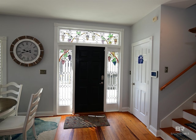 9397 S Bay Rd, Foley, AL 36535 - entryway with baseboards, stairs, and light wood-style floors