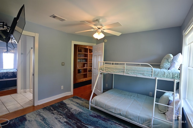 9397 S Bay Rd, Foley, AL 36535 - bedroom with a closet, visible vents, baseboards, ceiling fan, and a walk in closet