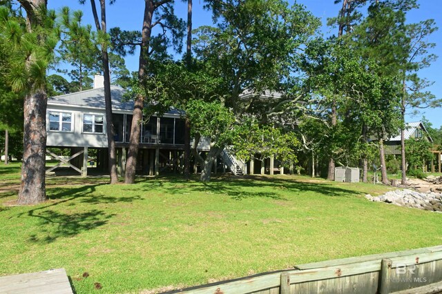 9397 S Bay Rd, Foley, AL 36535 - view of yard featuring stairs and a sunroom