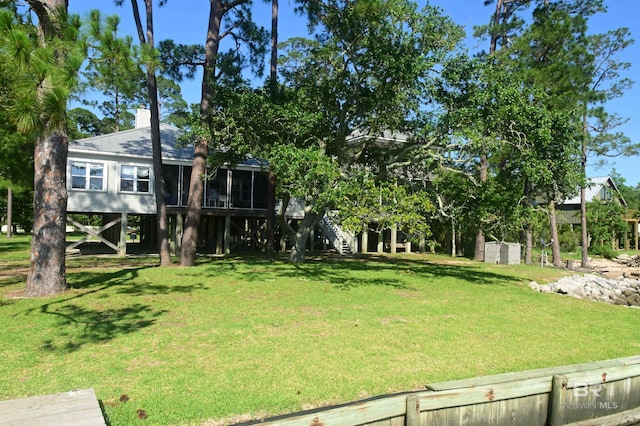 9397 S Bay Rd, Foley, AL 36535 - view of yard with stairs and a sunroom