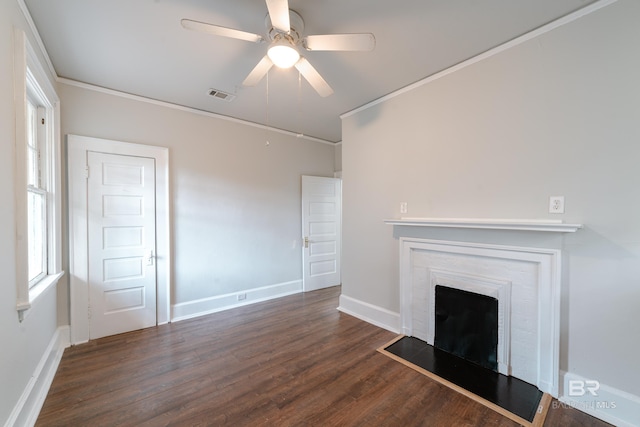 unfurnished living room featuring crown molding, ceiling fan, and dark hardwood / wood-style flooring