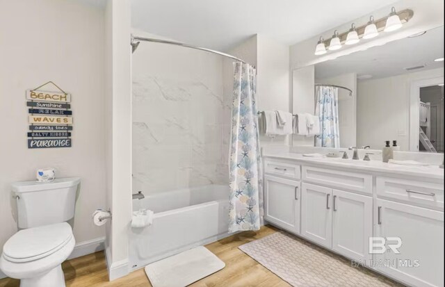 27070 Perdido Beach Blvd Unit 10W, Orange Beach, AL 36561 - full bath with shower / bath combo, wood finished floors, toilet, and vanity