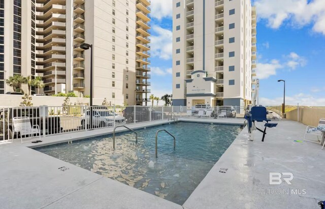 27070 Perdido Beach Blvd Unit 10W, Orange Beach, AL 36561 - community pool with fence and a patio area