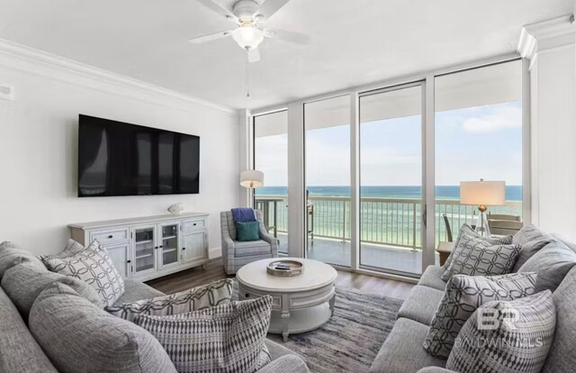 27070 Perdido Beach Blvd Unit 10W, Orange Beach, AL 36561 - living area featuring floor to ceiling windows, a ceiling fan, crown molding, and wood finished floors