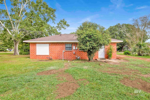 view of property exterior with a lawn