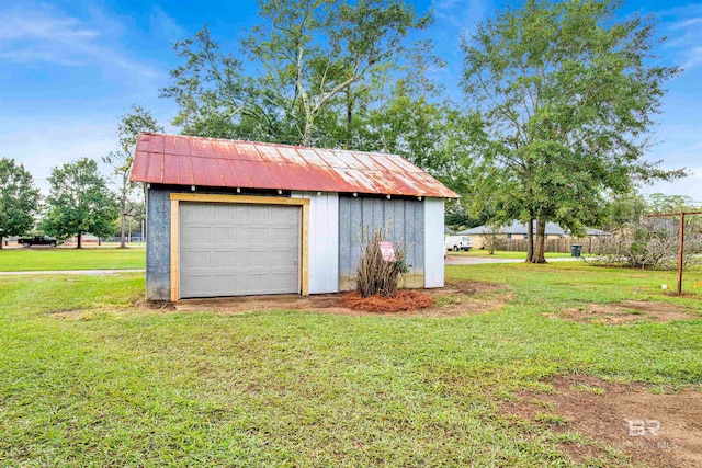 garage with a yard