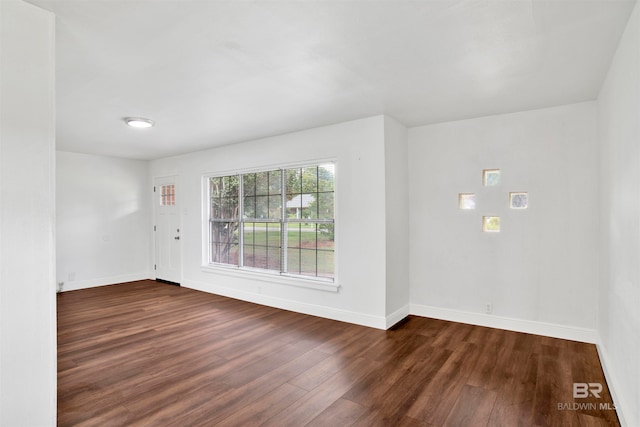 empty room featuring dark hardwood / wood-style floors