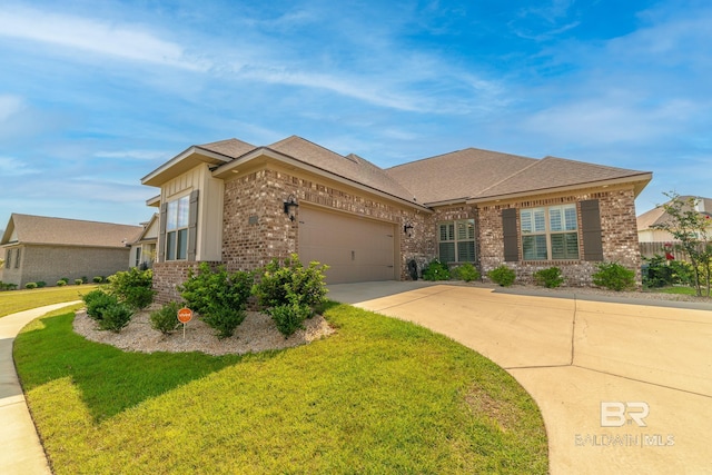 view of front facade with a front yard and a garage