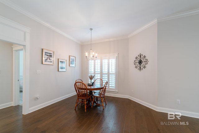 dining space with crown molding, dark hardwood / wood-style flooring, and a chandelier