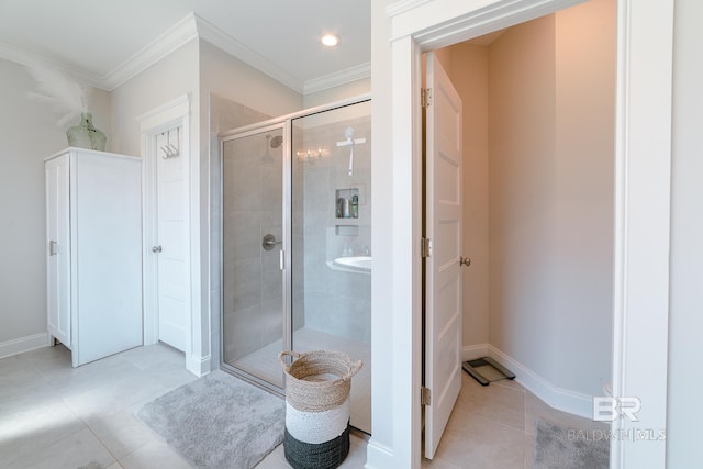 bathroom with tile patterned flooring, ornamental molding, and walk in shower