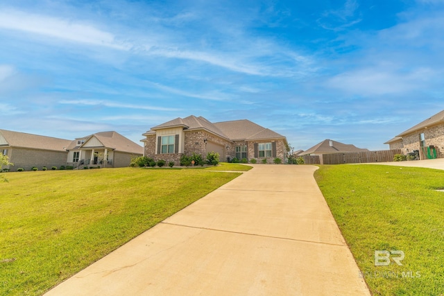 ranch-style home featuring a front yard