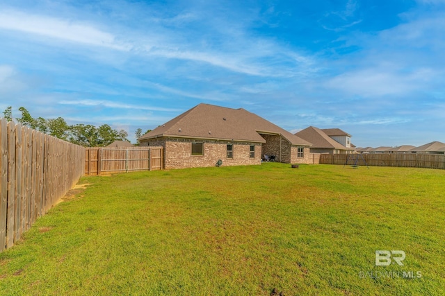 rear view of house with a lawn