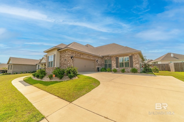 view of front of property with a garage and a front yard