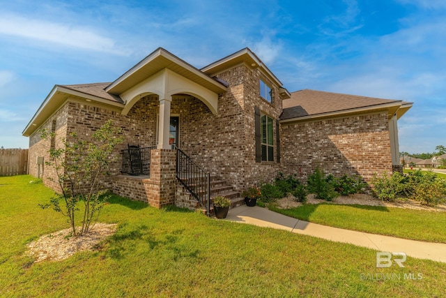 view of front of home with a front lawn