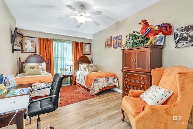 bedroom featuring light wood-type flooring and ceiling fan